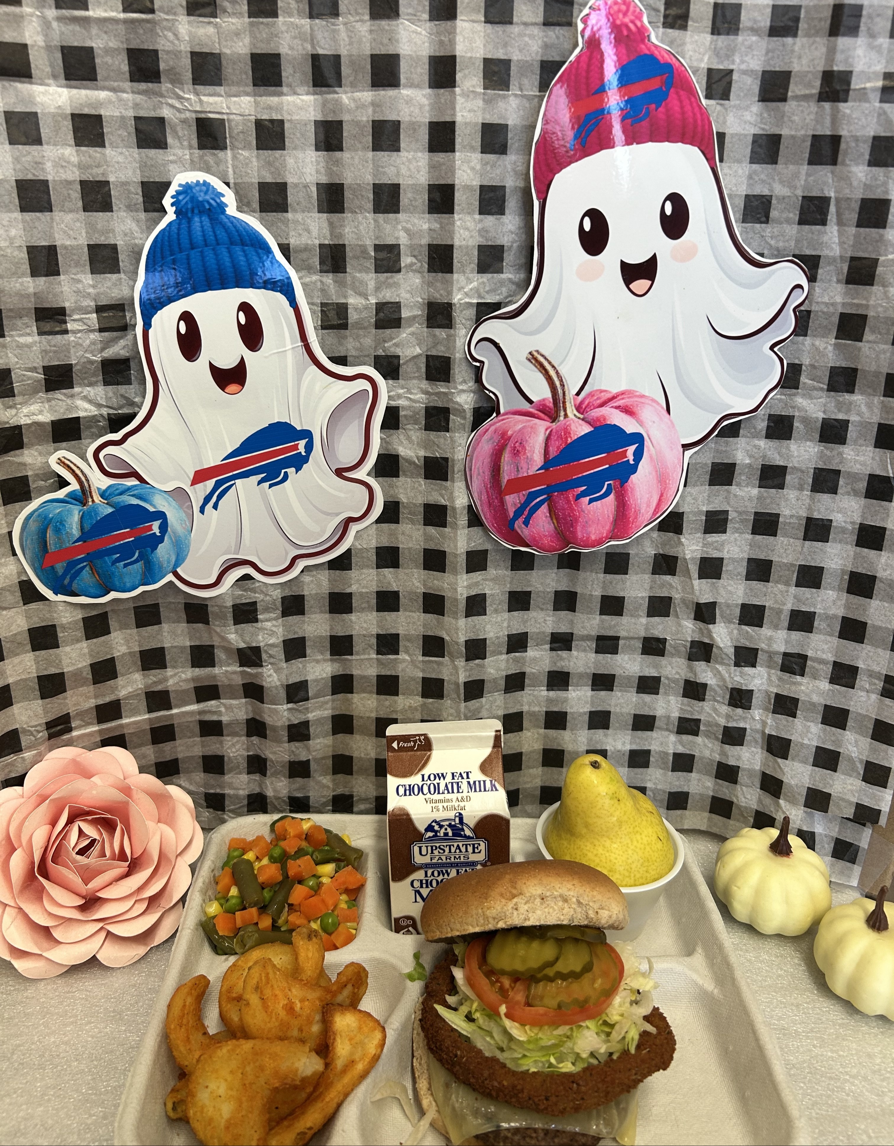 School 207- Lunch served on 10.28.25 Rodeo Burger WG Burger bun, Twister Taters, Vegetable Medley, Pear and Chocolate Milk