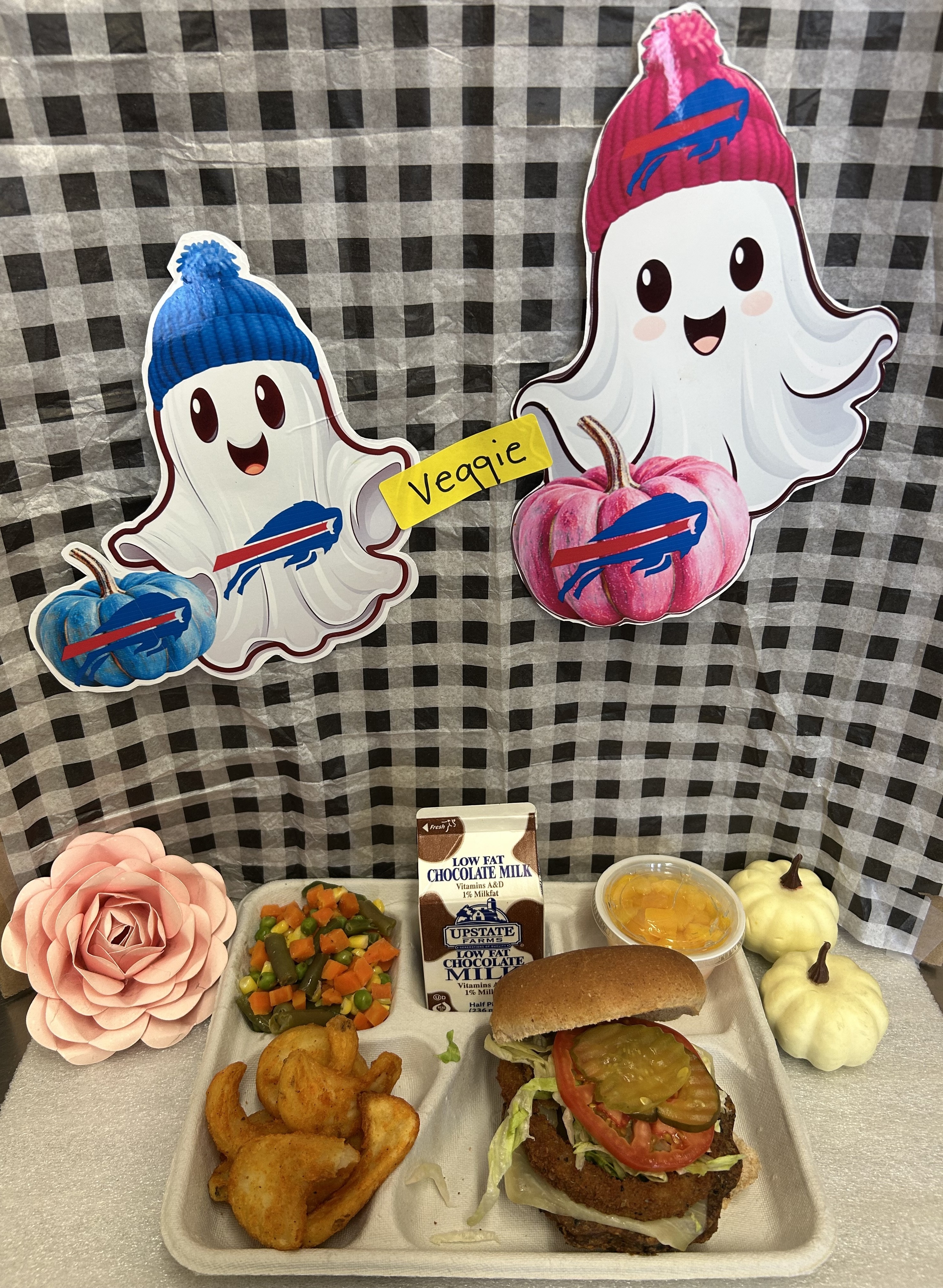 School 207- Lunch served on 10.28.25 Veggie Burger WG Burger bun, Twister Taters, Vegetable Medley, Cupped Peaches and Chocolate Milk