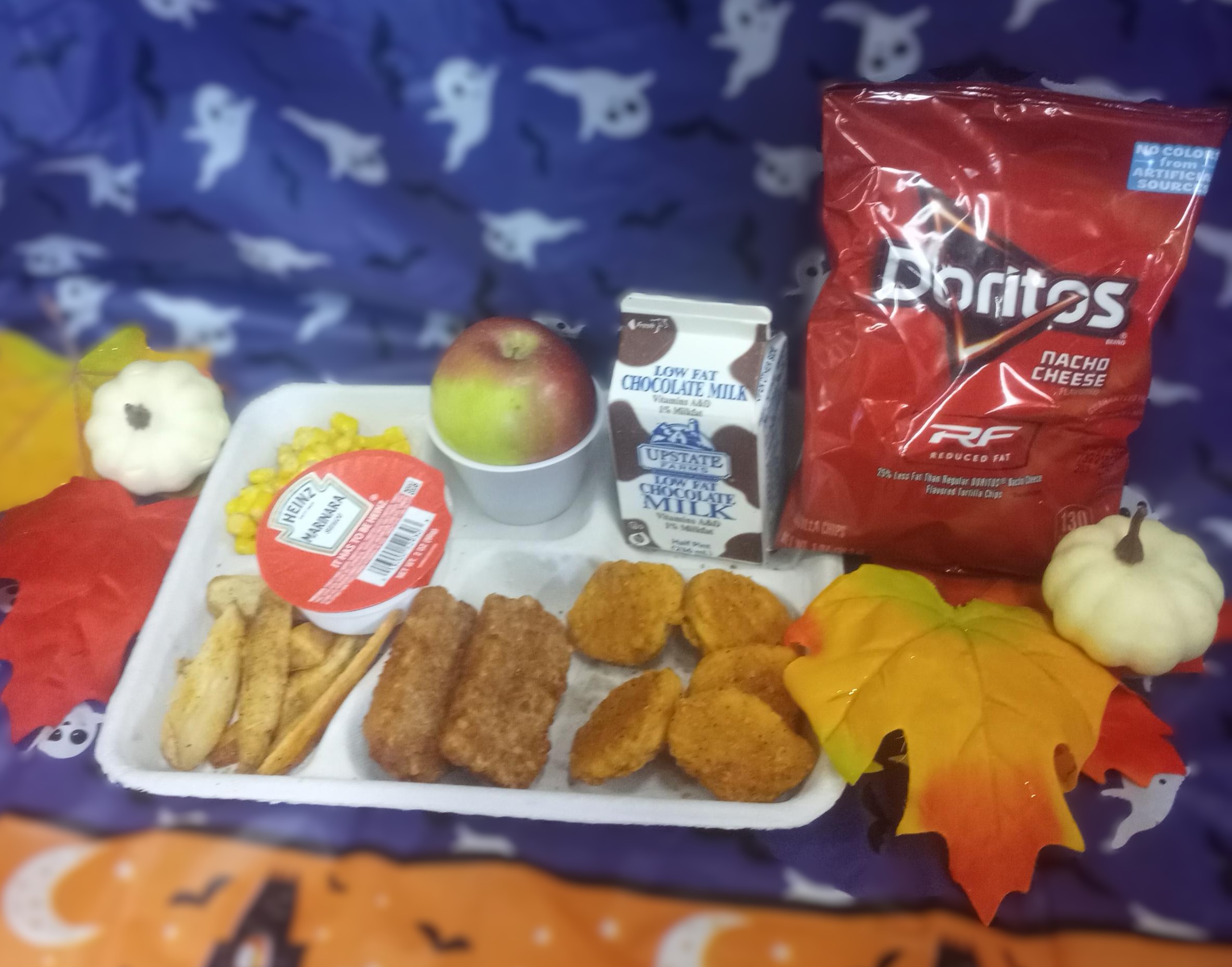 School 207- Lunch served on 10.31.25 Chicken Tenders,Pizza Crunchers, Potatoes Wedges, Sweet Corn, Doritos, Apple and Chocolate Milk