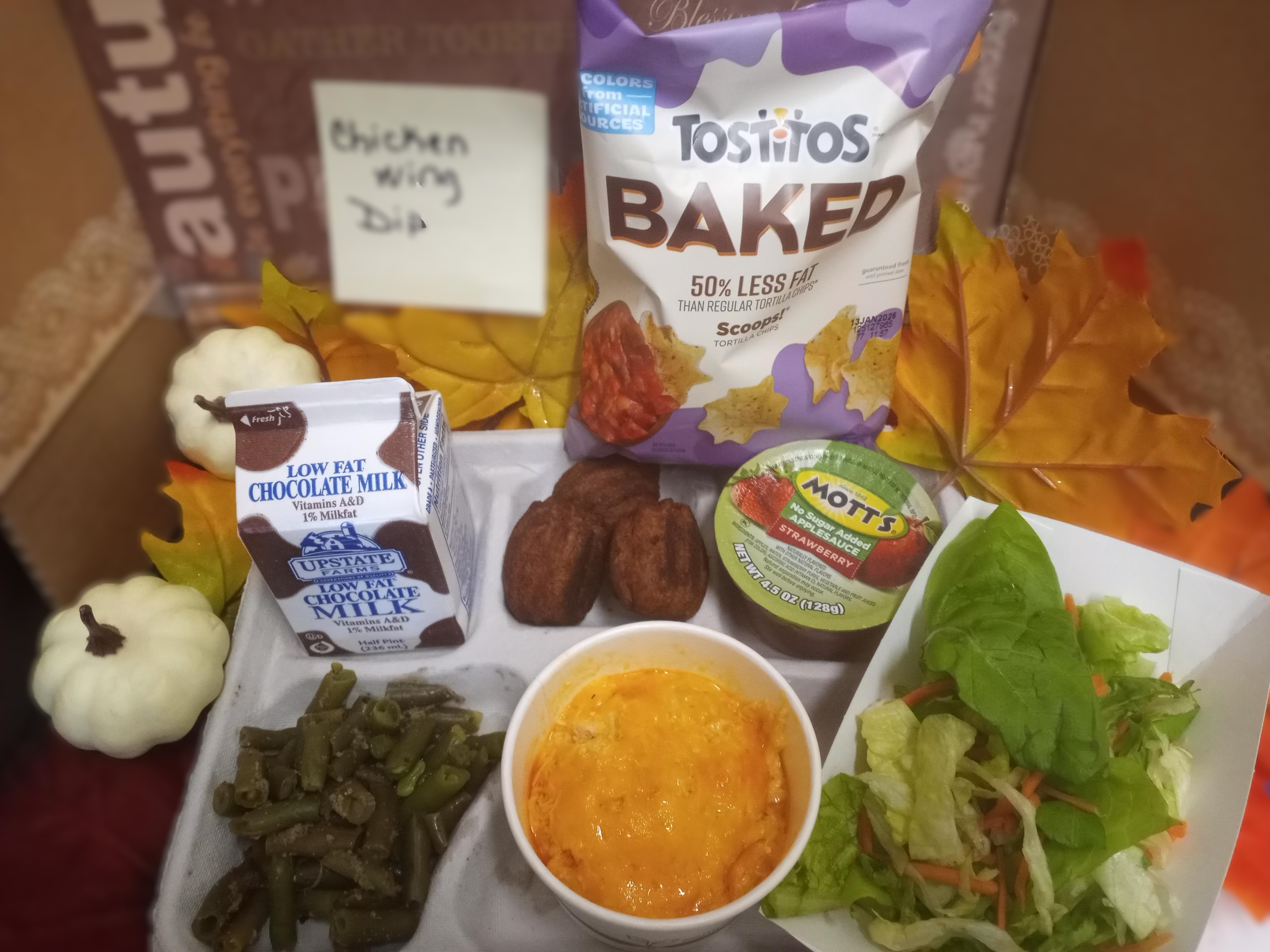 School 207- Lunch served on 11.13.25 NY Buffalo Chicken Wing Dip, Tostitos, Green Salad, Green Beans, Churros bite and Chocolate milk