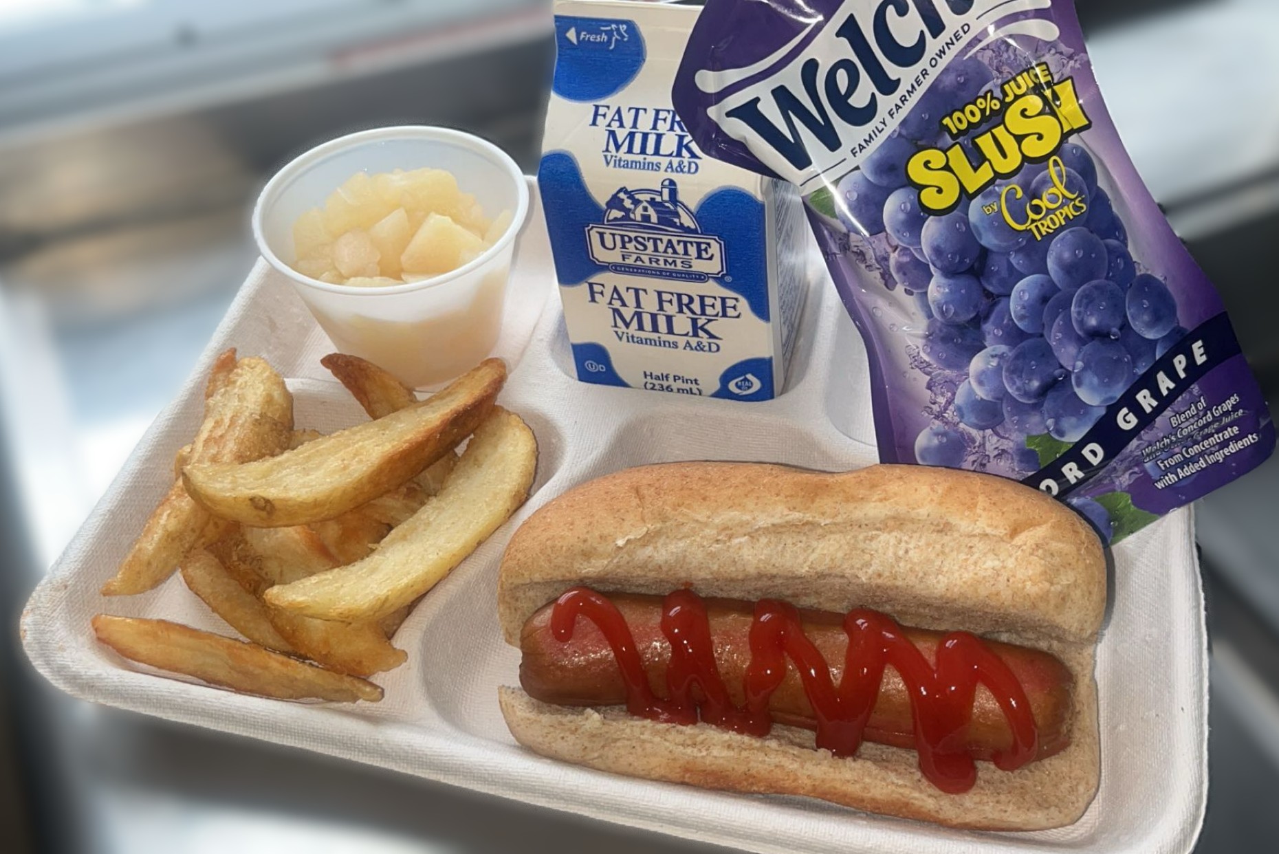 School 30 - Lunch served on 2.26.26 Beef Hot Dog, Potato Wedges, NY Grape Slushy, Cupped Pears and Milk
