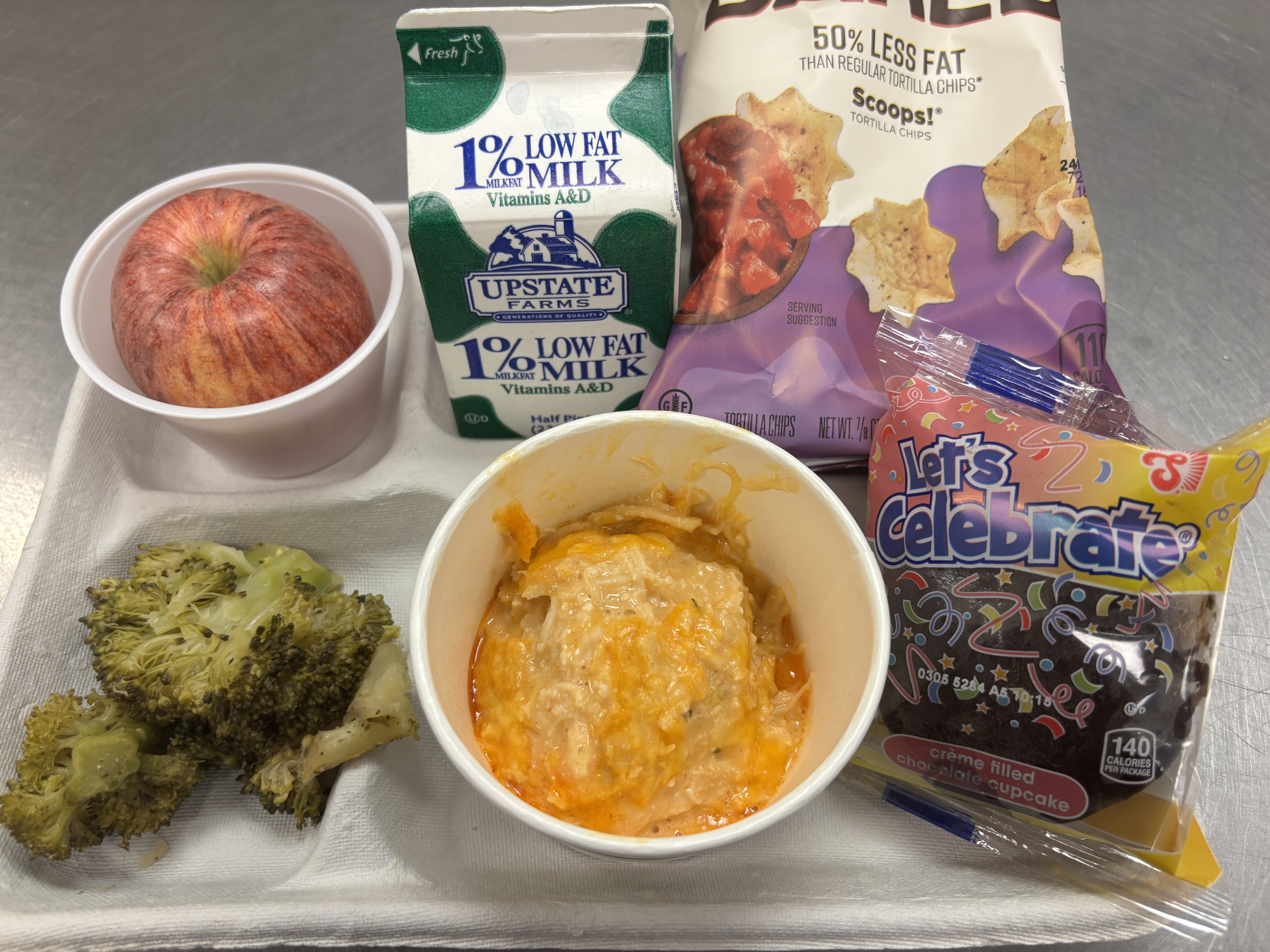 School 61- Lunch served on 3.3.26 Chicken wing dip, broccoli, Tostitos scoops, apple, chocolate cupcake and milk