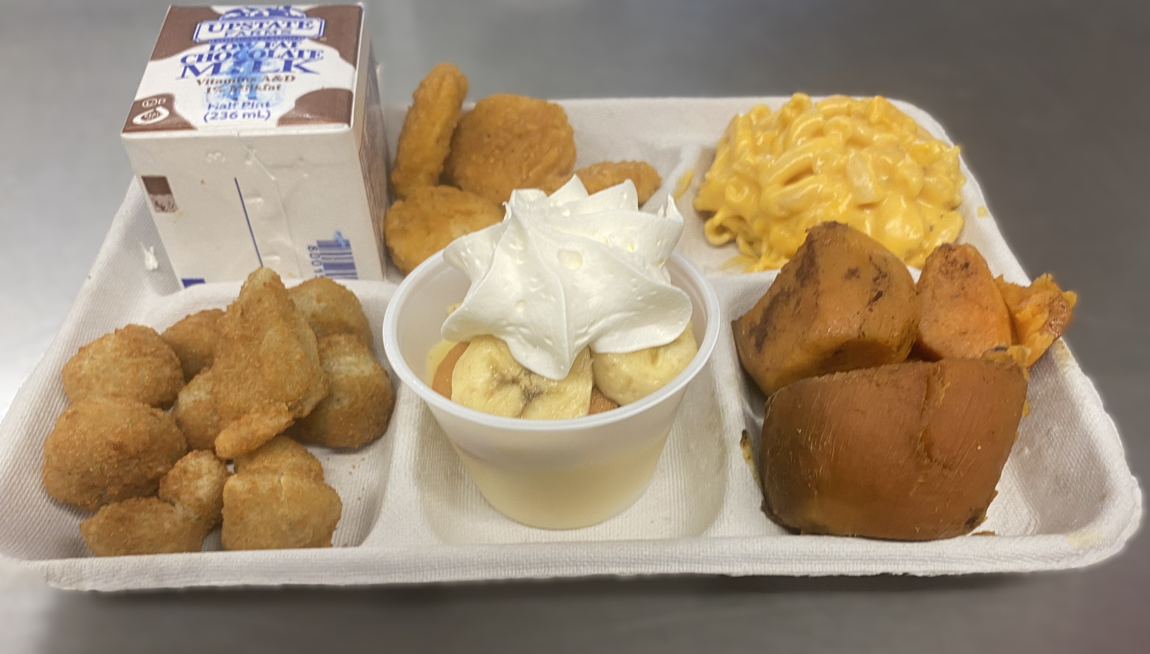 School 92- Lunch served on 2.27.26 Chicken nuggets, mac & cheese, pizza crunchers, jams, vanilla pudding and chocolate milk
