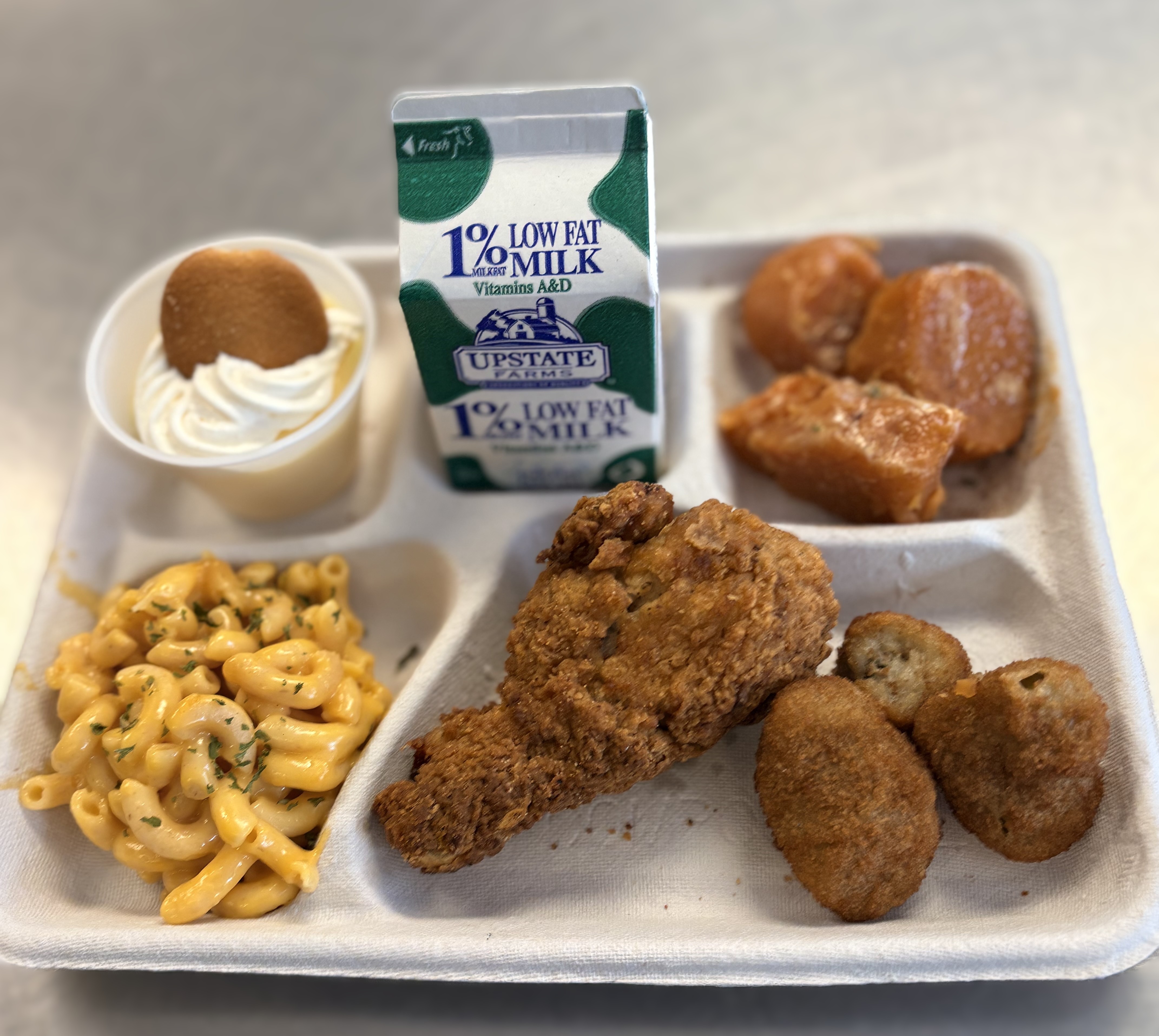 School 198- Lunch served on 2.27.26 Celebrating BHM Breaded chicken, Mac & Cheese, pizza crunchers, vanilla pudding and milk