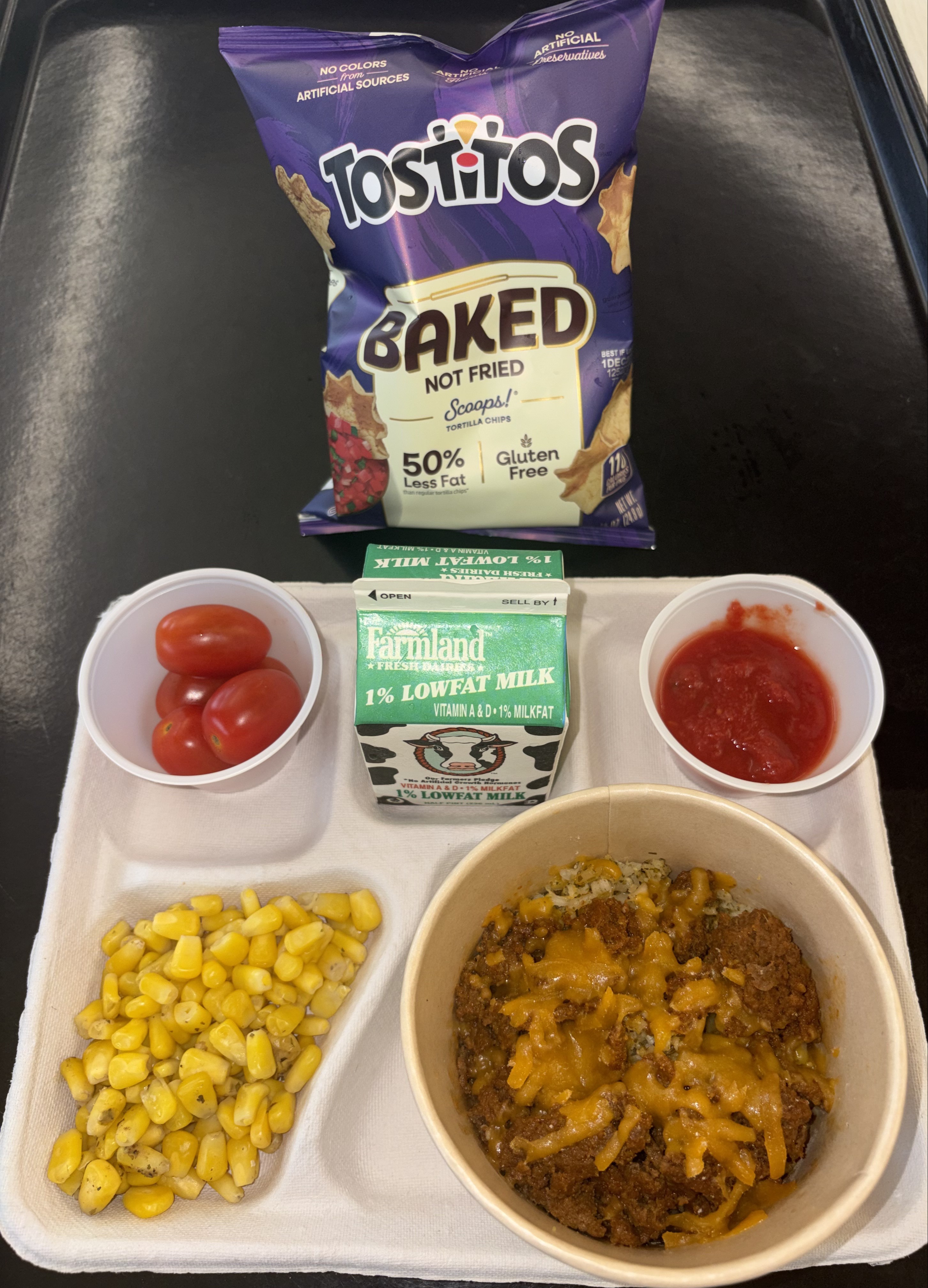 School 72- Lunch served on 9.9.26 Taco Bowl, Beef taco meat, Shredded Cheddar, Cilantro Rice, Wheat Tortilla, Sweet Corn, tomatoes, Salsa, Tostitos, Chocolate Milk