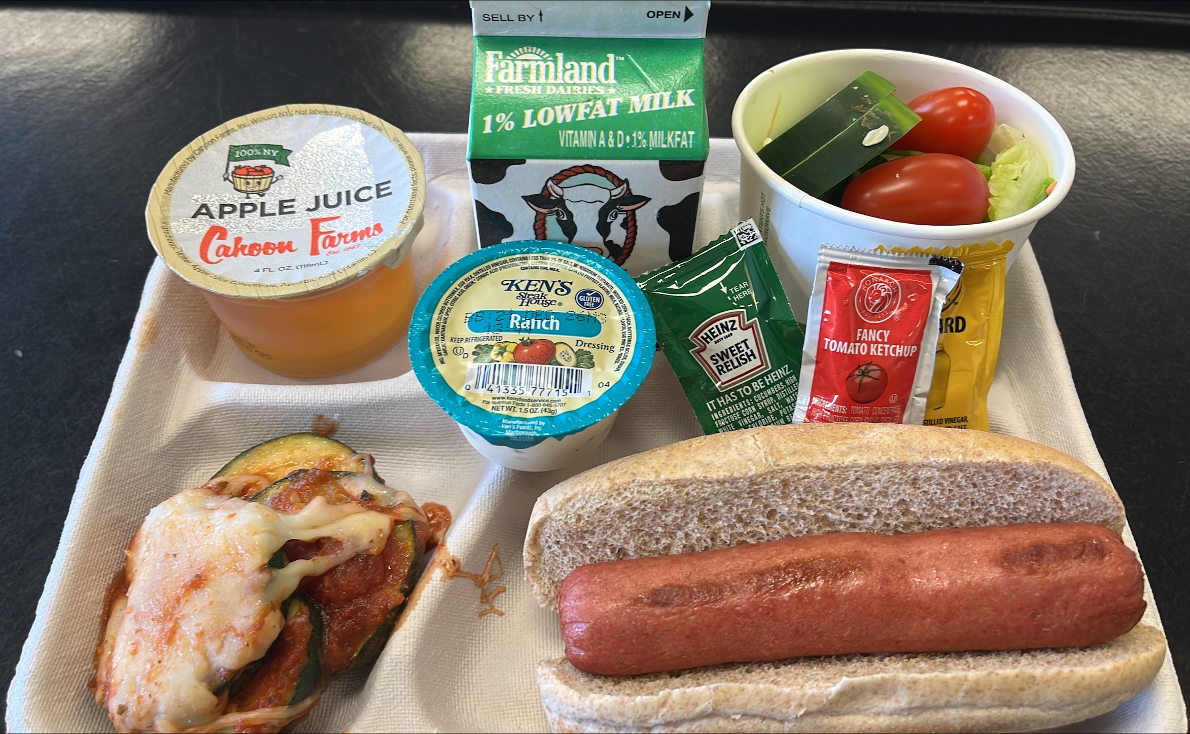 School 301- Lunch served on 9.10.26 NY Beef Hot Don on WG Bun, NY Zucchini Parmesan NY garden Salad, Cahoon Apple Juice & Milk