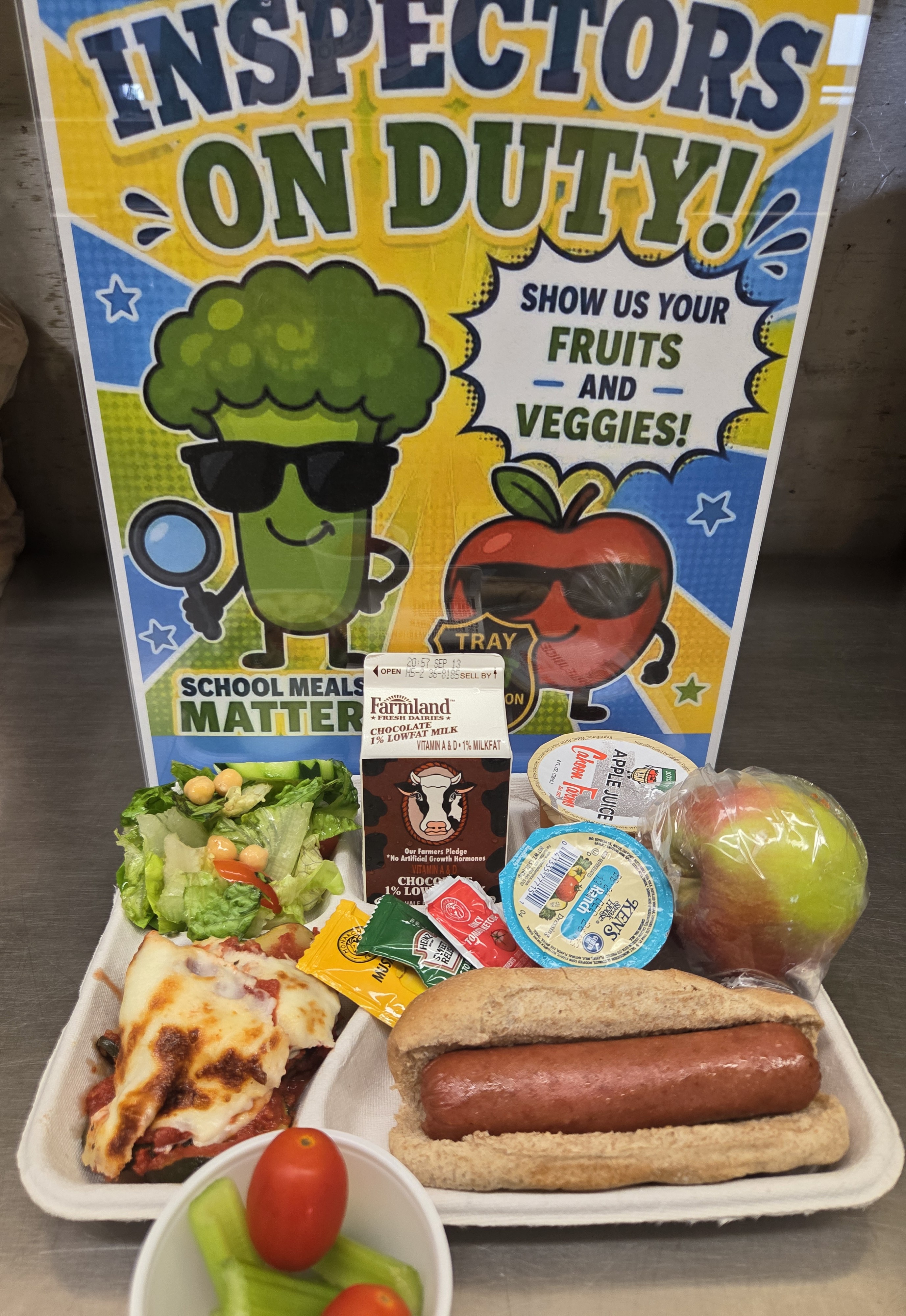 School 207- Lunch served on 9.10.26 NY Beef Hot Don on WG Bun, NY Zucchini Parmesan NY garden Salad, Cahoon Apple Juice & Milk