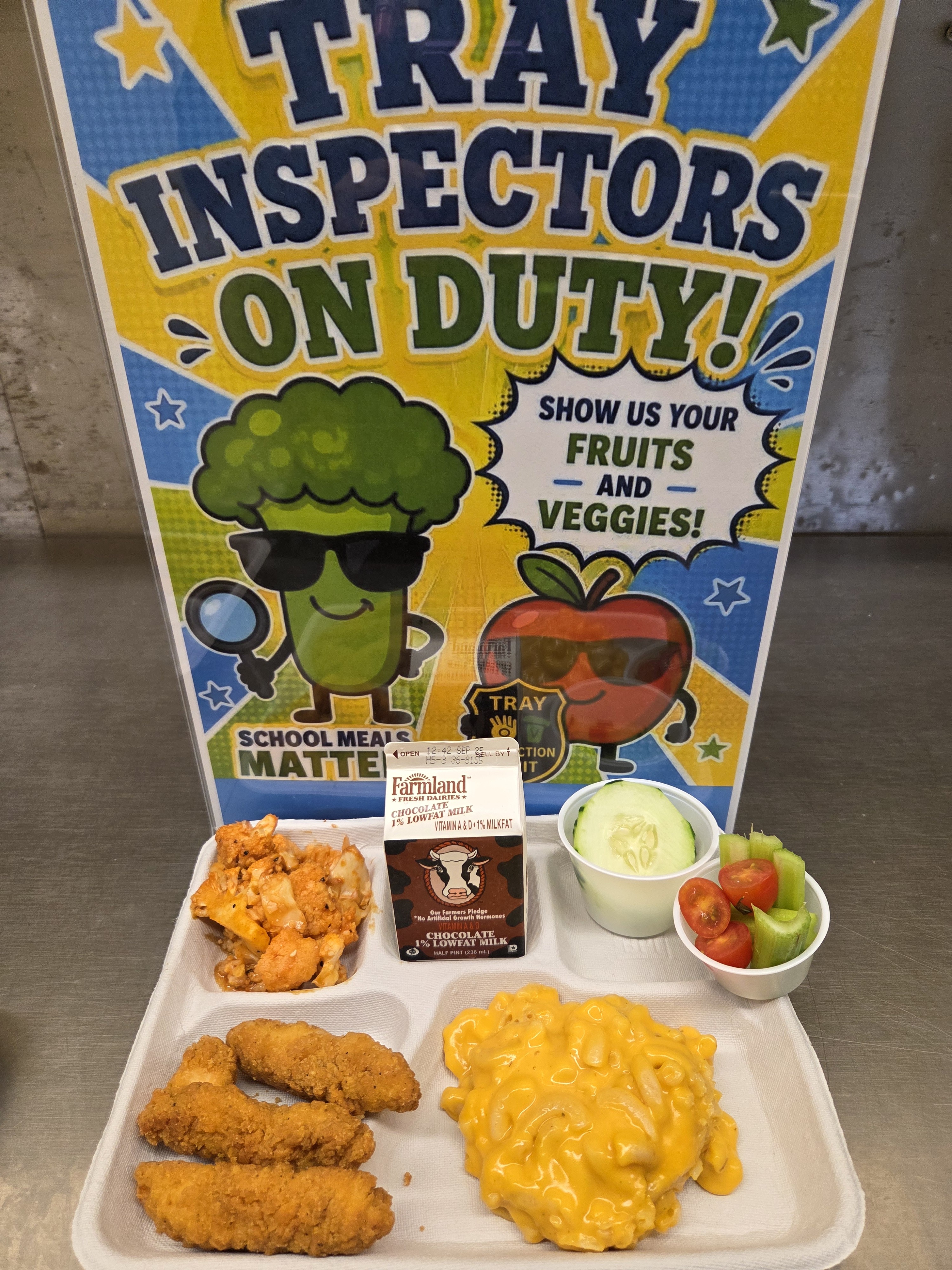 School 207- Lunch served on 9.11.26 Chicken Tenders, Macaroni & Cheese, Cucumber Slices, Roasted Cauliflower, Tomatoes & Celery, Chocolate Milk