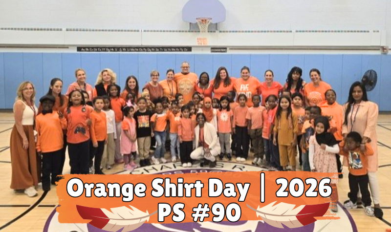 Large group of students and adults wearing orange shirts in the school 90 cafeteria