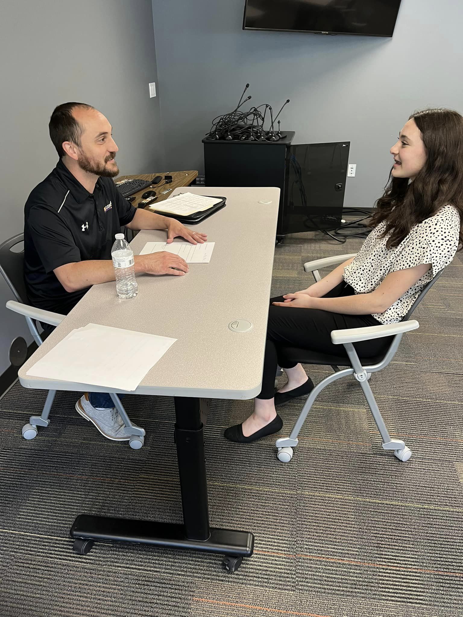 Teacher interviewing student