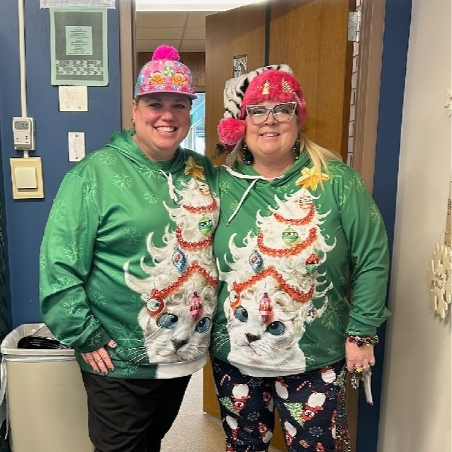 2 teachers in christmas sweaters