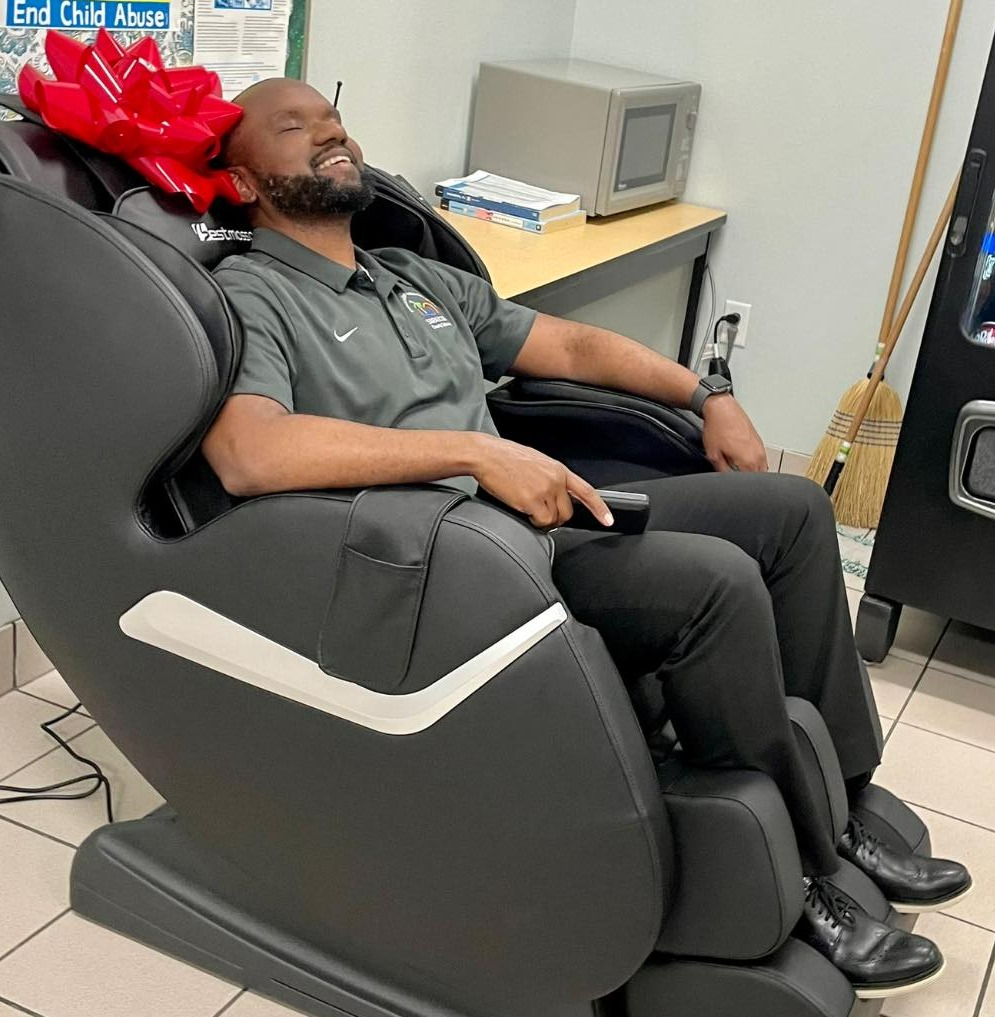 MMS principal Mr. Lerebours enjoying our new massage chair.