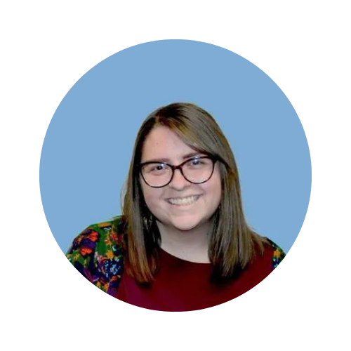 headshot of a teacher with a blue background