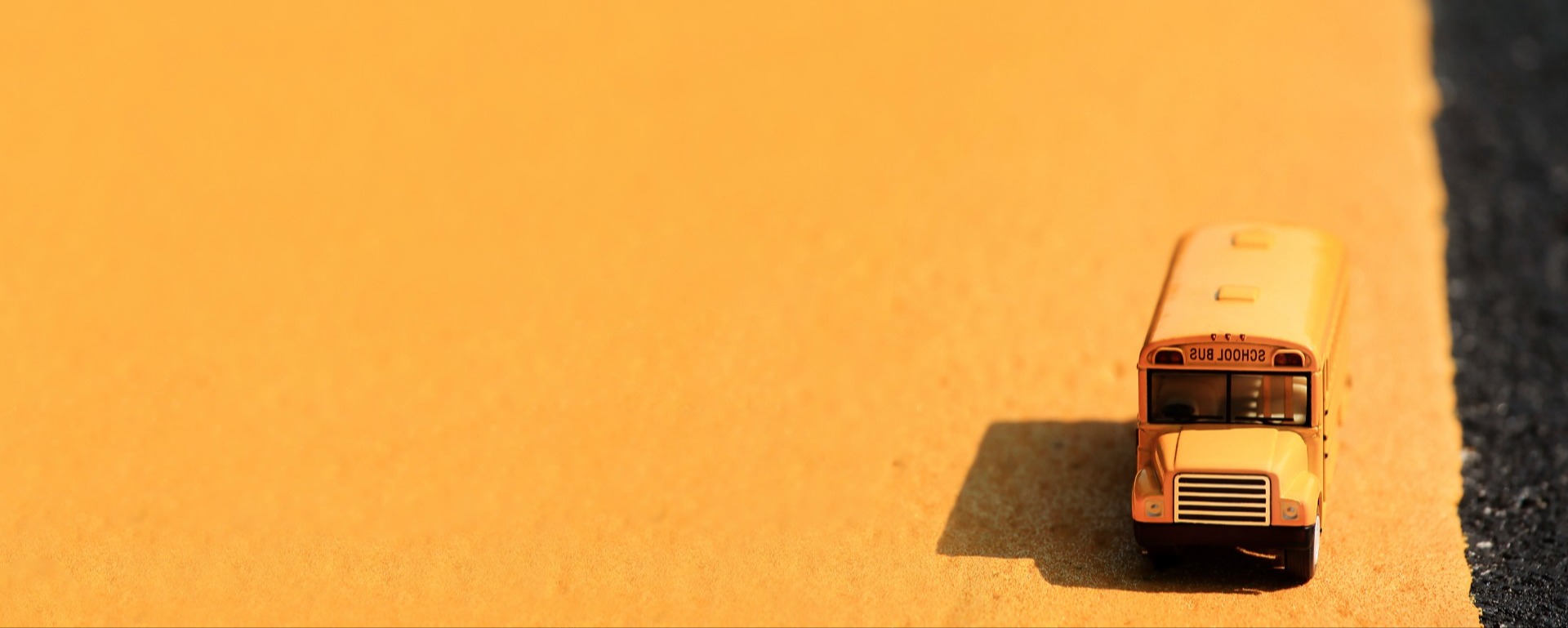 school bus on a yellow background