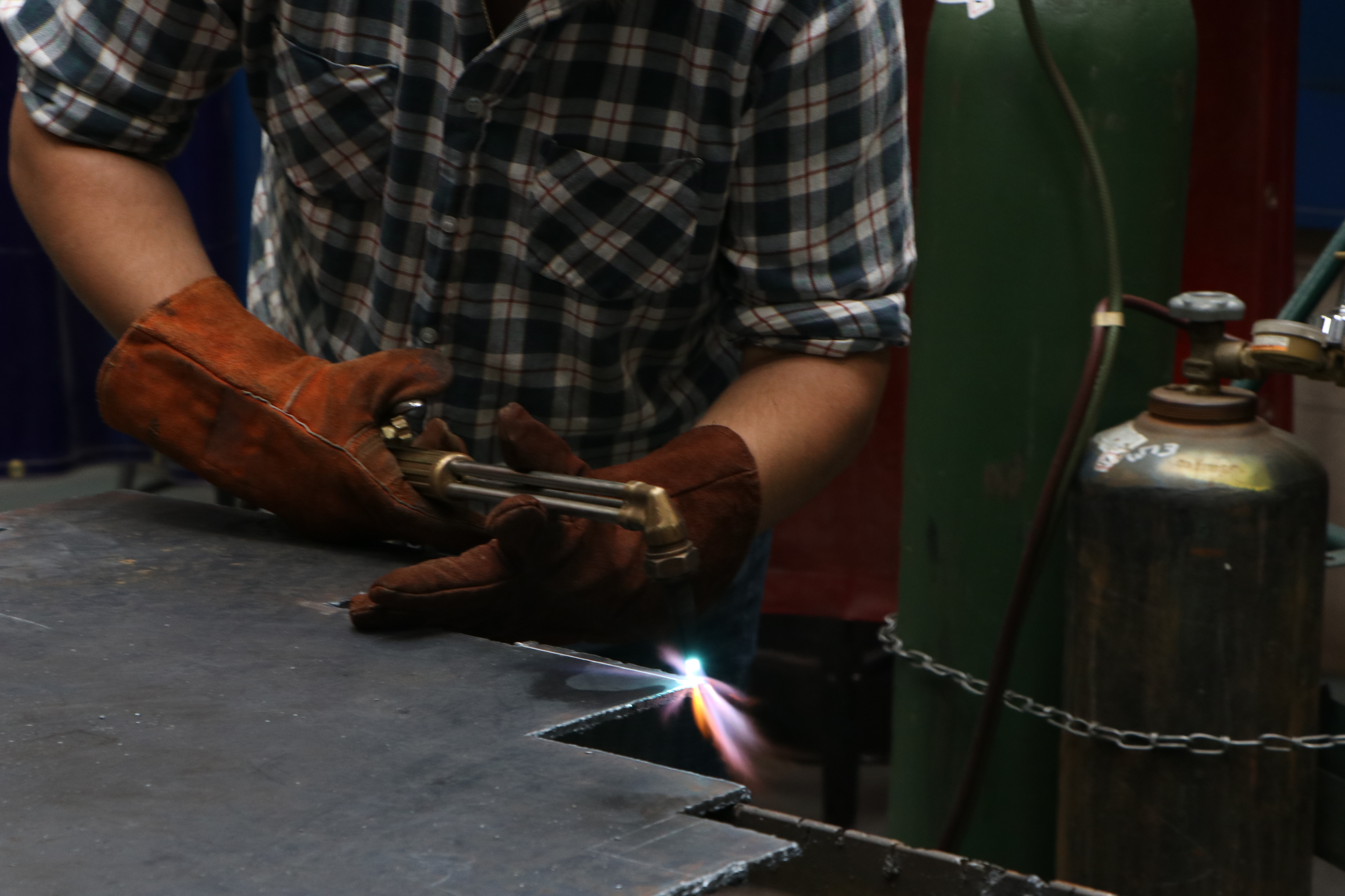 A man holding a welding machine