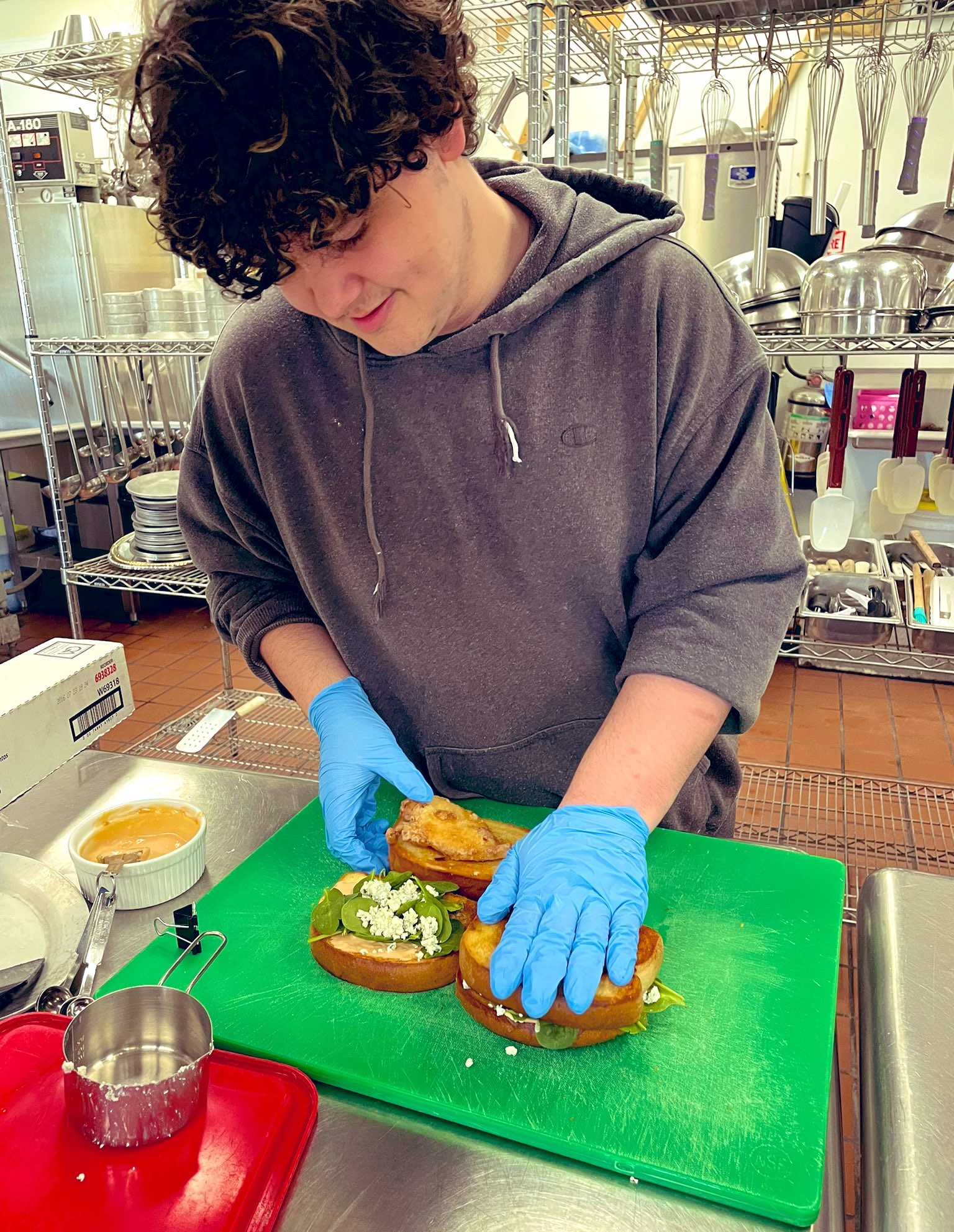 A boy is making a sandwich