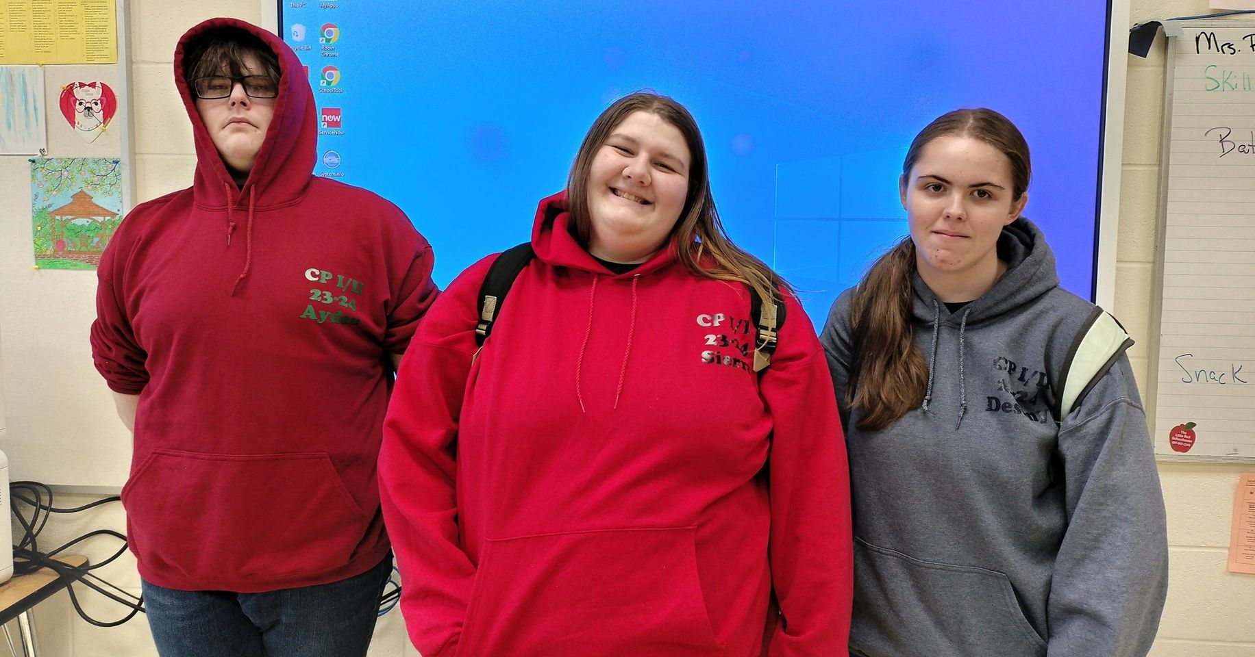 three students posing for a photo