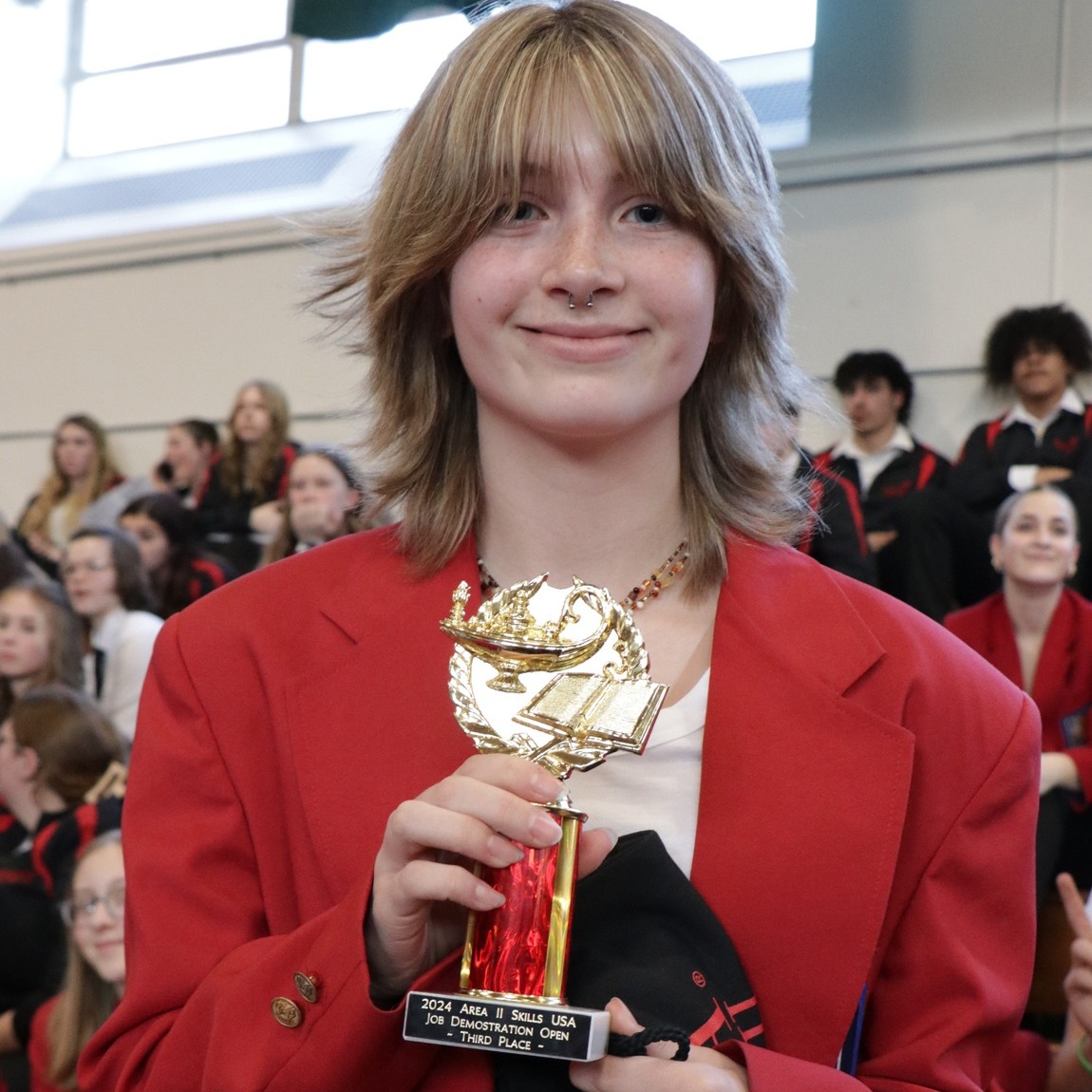 A woman showing her trophy