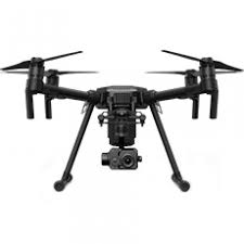 A black quadcopter drone with four propellers and a mounted camera