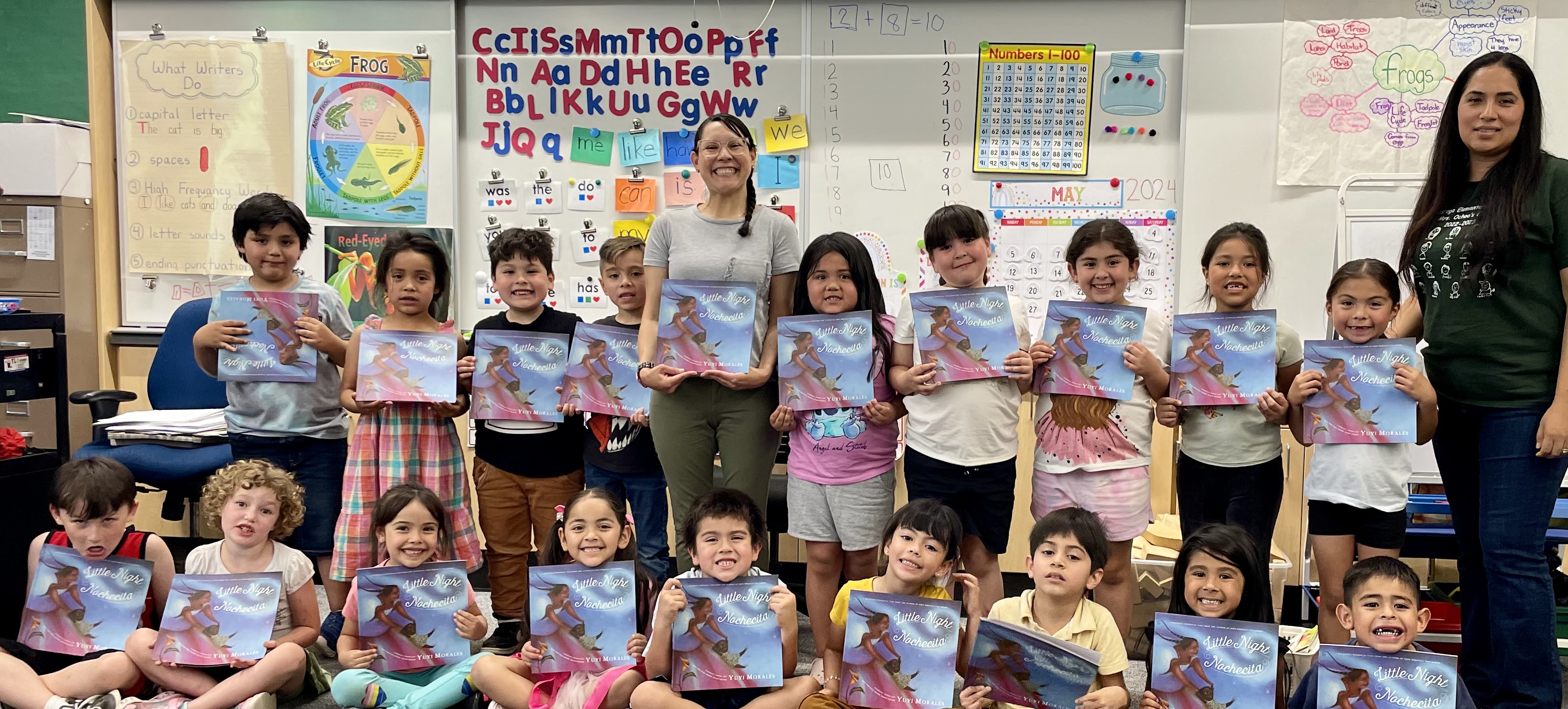 Rapper class students holding a book