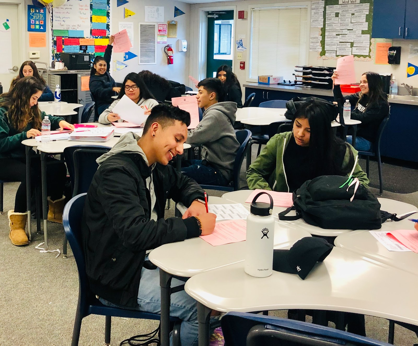 Students in a classroom diligently working on their homework assignments.