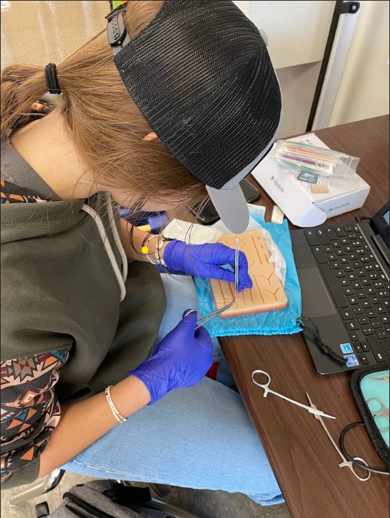 The Health Occupations class learned suturing techniques in their Nursing module.