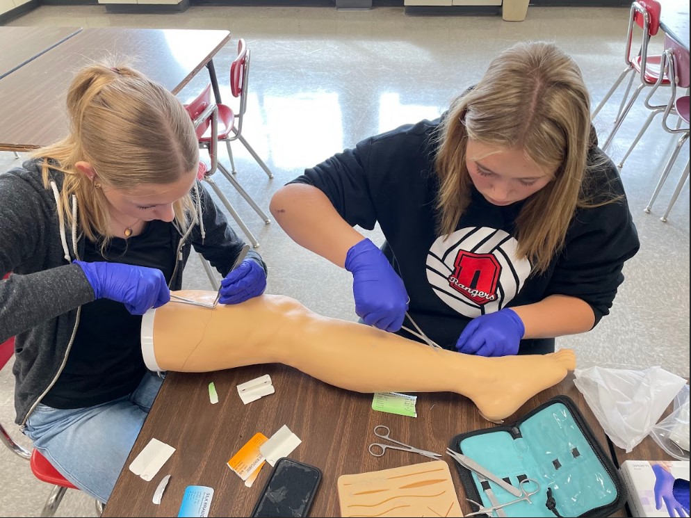 The Health Occupations class learned suturing techniques in their Nursing module.