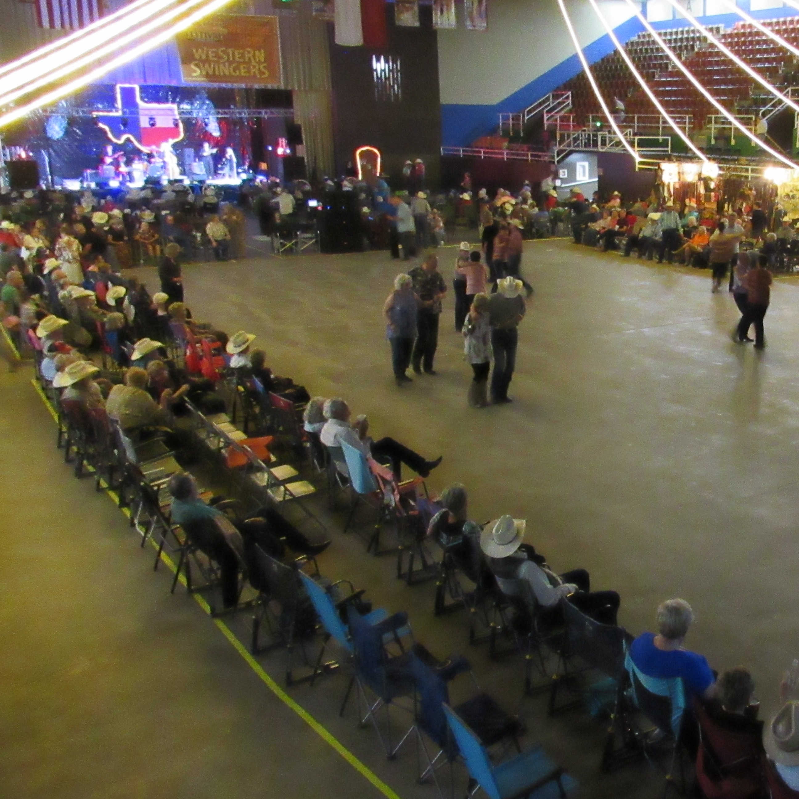 People dancing with band in background