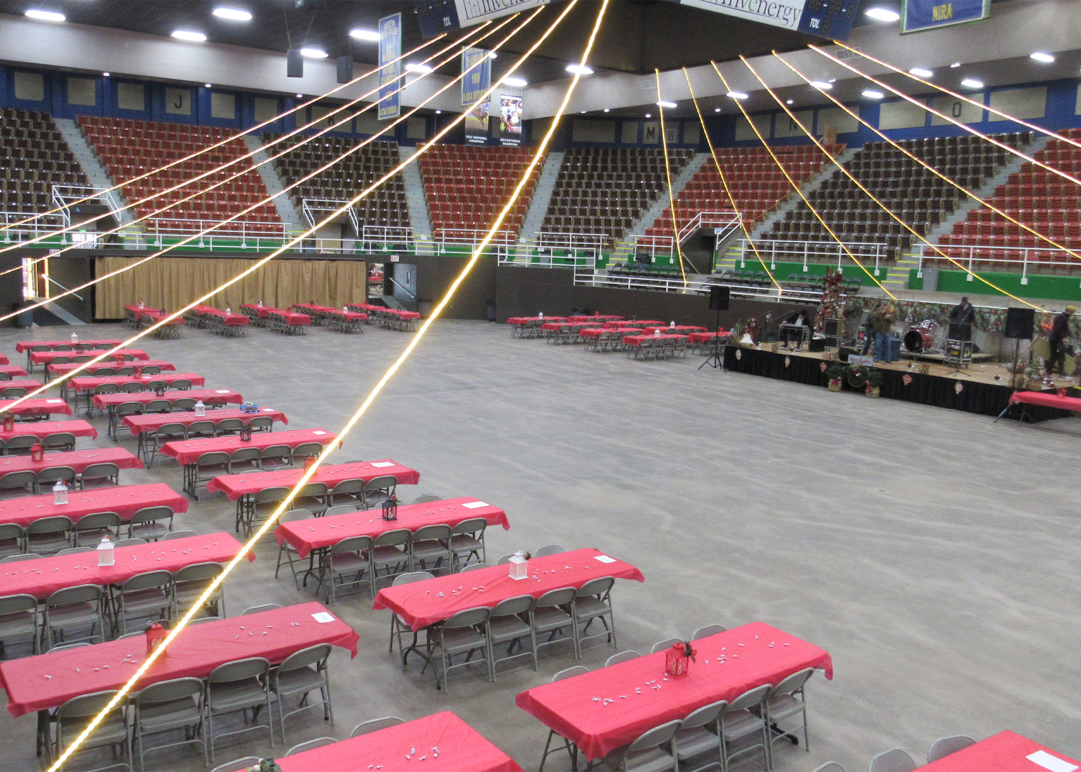 Christmas tables set up in front  of band stage