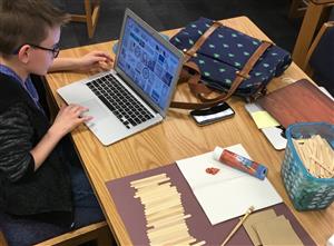 student doing crafts