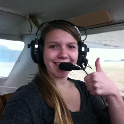 student on the aviation program piloting a plane