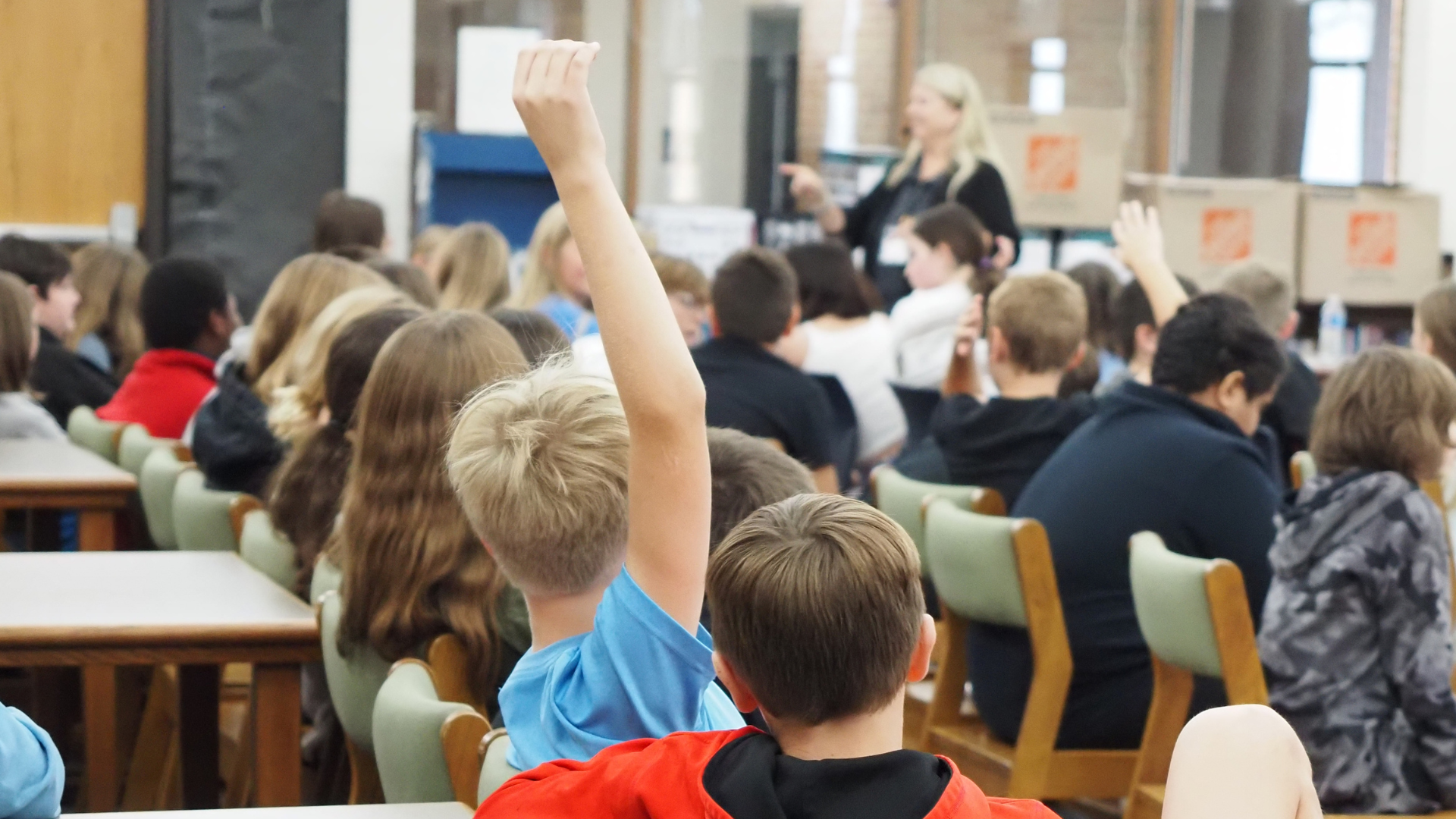 student raising hand