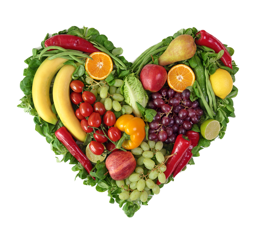 A heart shaped arrangement of colorful fruits and vegetables 