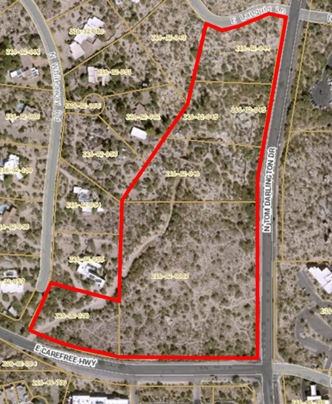 The image you sent is an aerial view of a large residential lot in Carefree, Arizona. The lot is outlined in red and has several identifiable features. 