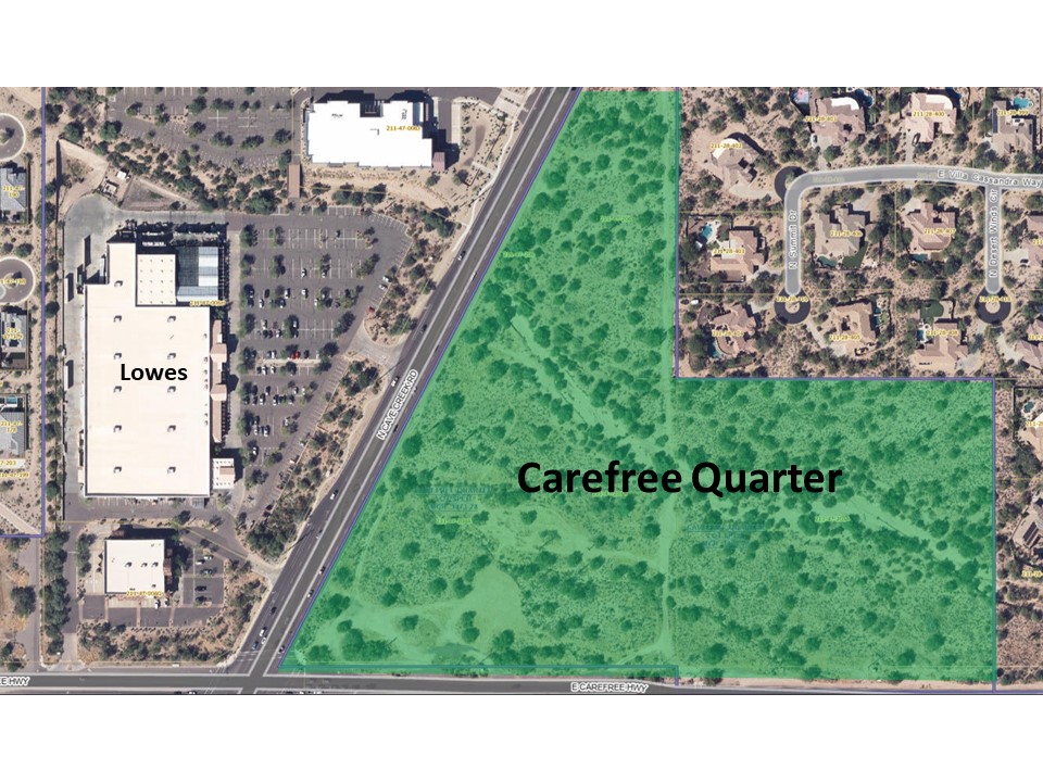 The image you sent me shows an aerial view of a large, vacant lot next to a Lowe's store in an area called Carefree Quarter. The field is surrounded by trees and grass, and there is a large parking lot in the middle of the field.