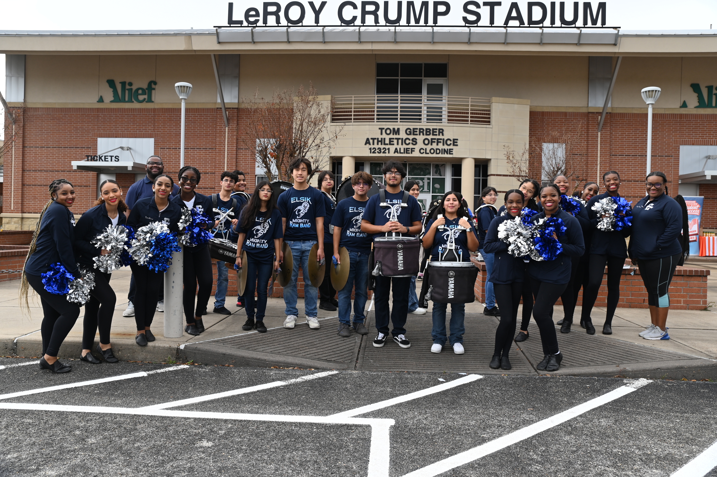 Alief ISD cheerleaders, mascots, choir students, and sponsors support the annual Stuff-A-Bus by performing for community members and donating uniforms and school supplies for our pantry.