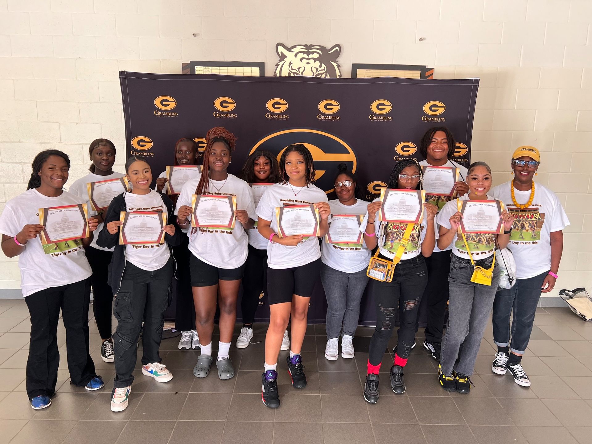 group of high school students pose with Grambling certificates 