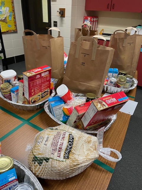 table full of items for thanksgiving day meal