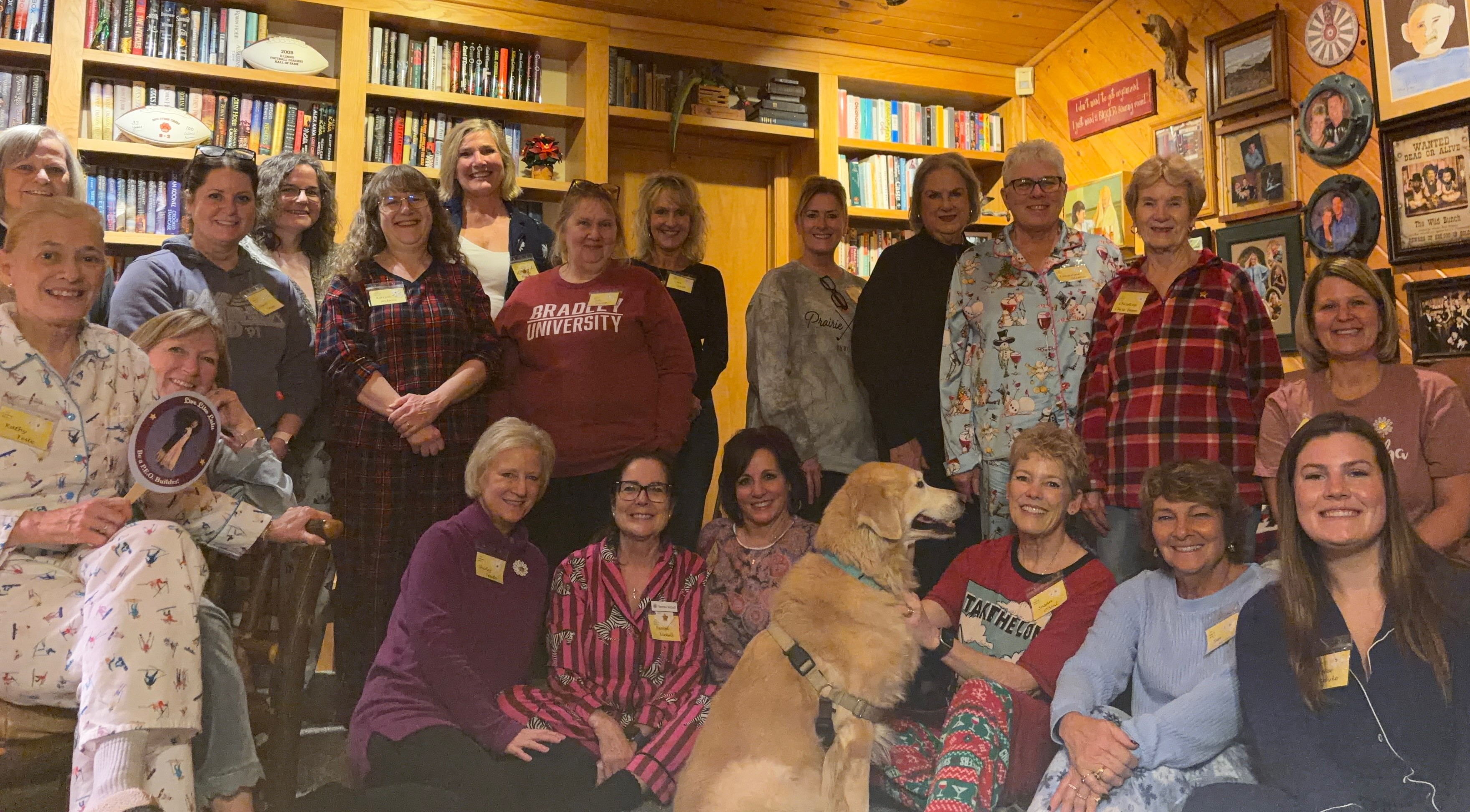 women in pajamas in front of bookcase