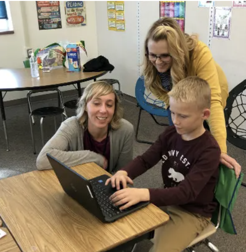 teachers working with students