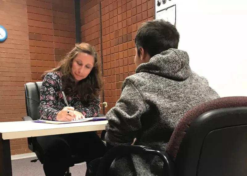 School Psychologist in therapy with a student