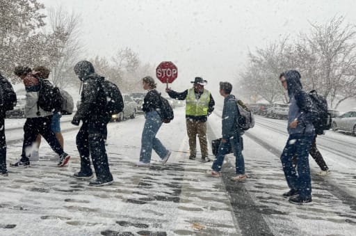 students walking on snow