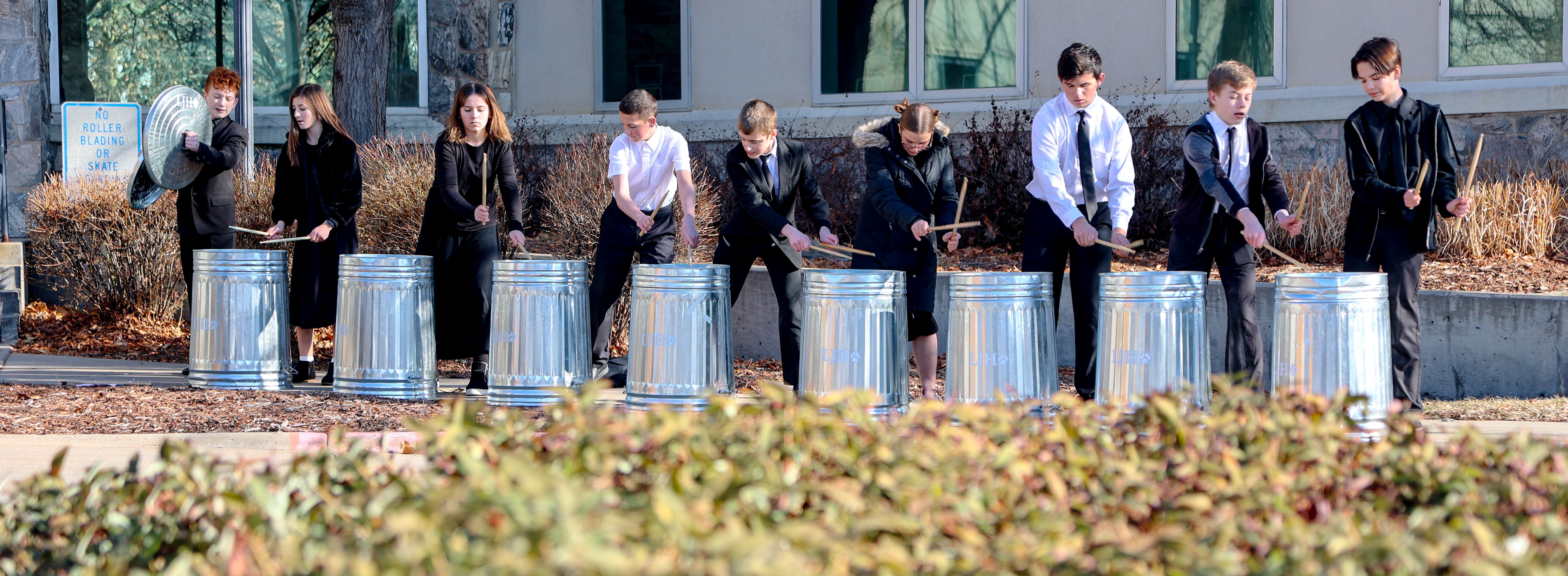 Students playing trash cans