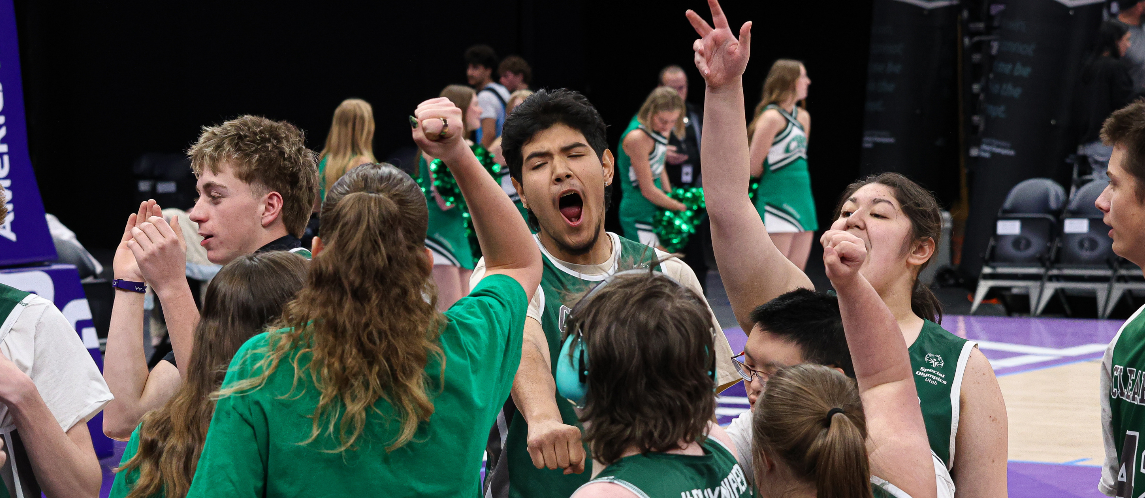Students celebrating during a basketball game.