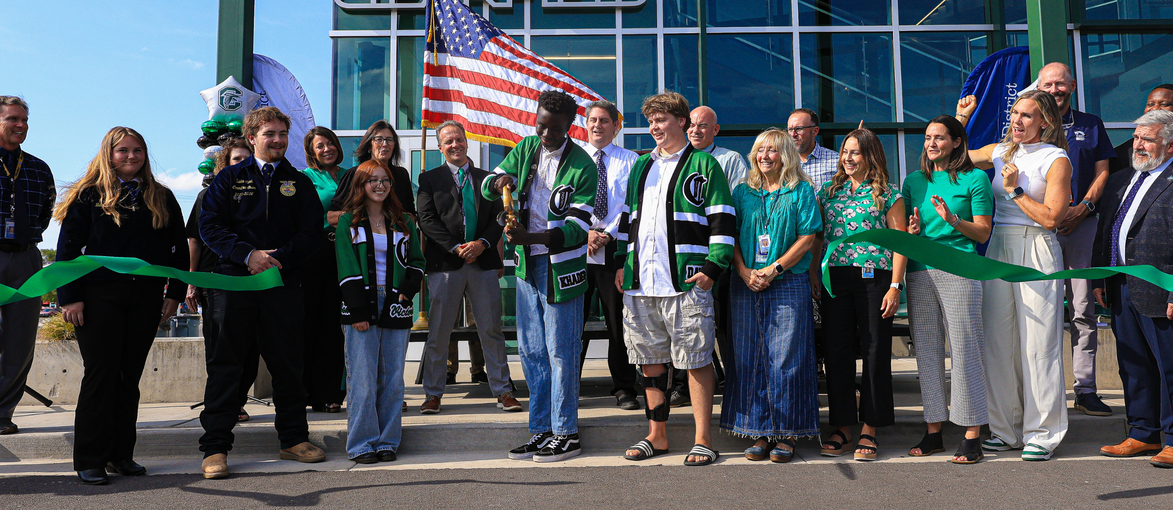 Members of Davis School District and Clearfield High School celebrate as they cut the ribbon for their new CTE Building