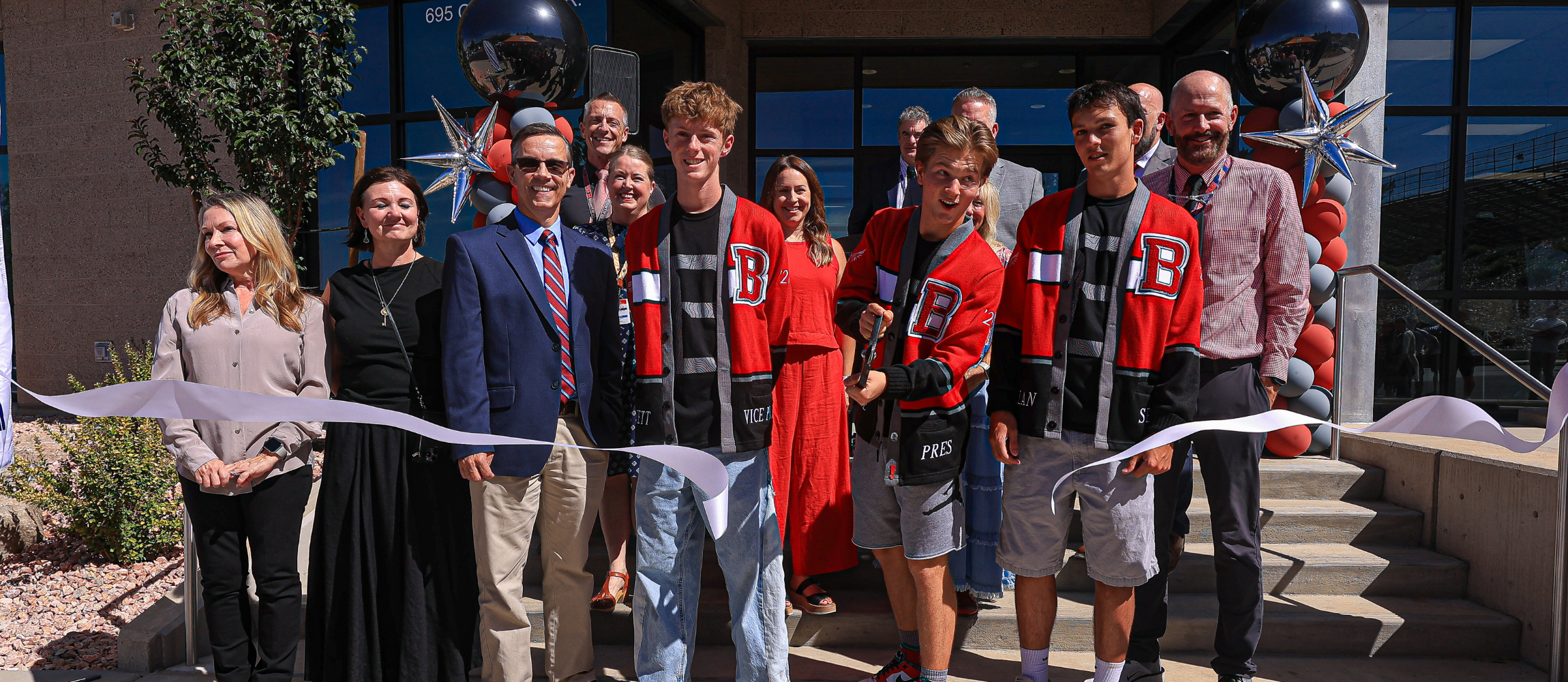 Bountiful High students cutting a ribbon
