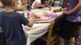 Kids painting in the library