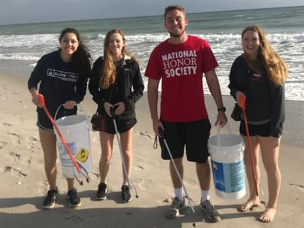 students cleaning the beach