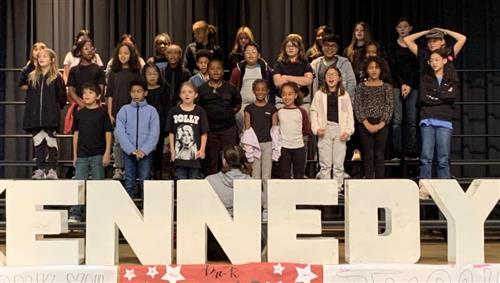 Kennedy Choir students standing on stage