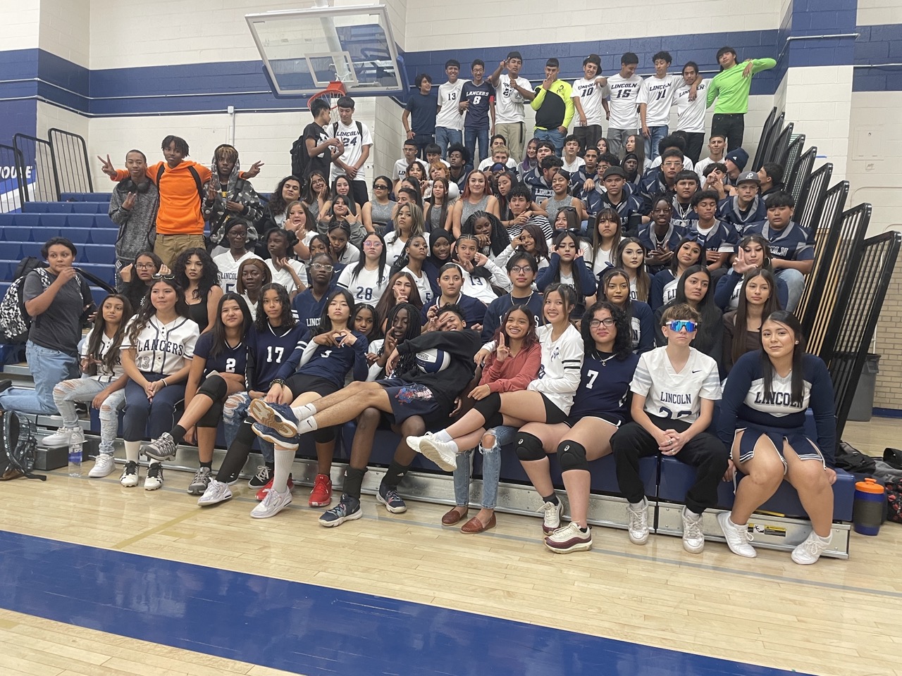 all athletes students sitting on the bench